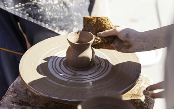 Clay artist, detail of a handyman, craft