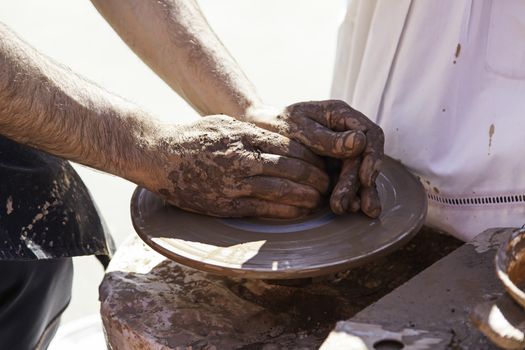 Clay artist, detail of a handyman, craft