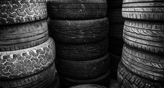 Old tires, detail of old car wheels, rubber, pollution
