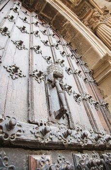 Old medieval door, detail of an old door of a castle