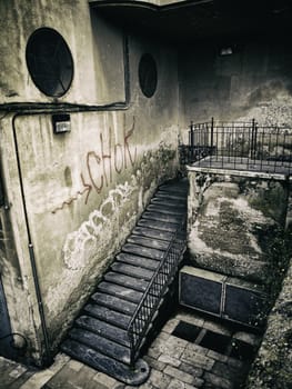 Old stone stairs, detail of a pedestrian stairs in the city, dirt and neglect
