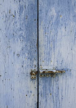 Old wooden door, detail of a medieval gate, art and antiquity
