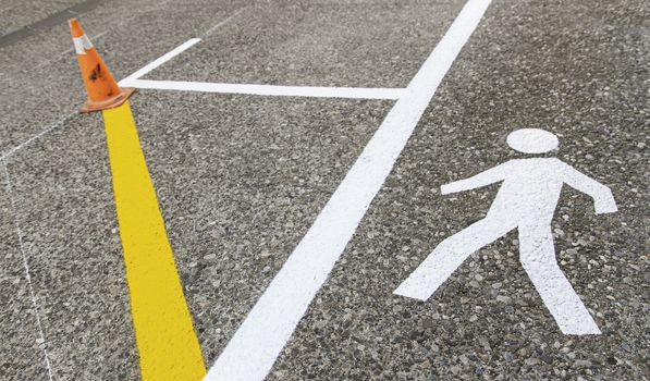 Pedestrian on the asphalt, detail of an area for pedestrian use, information and security