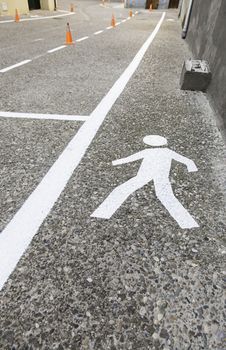 Pedestrian on the asphalt, detail of an area for pedestrian use, information and security