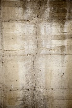 Cracked concrete wall, detail of abandoned background, ruin and insecurity