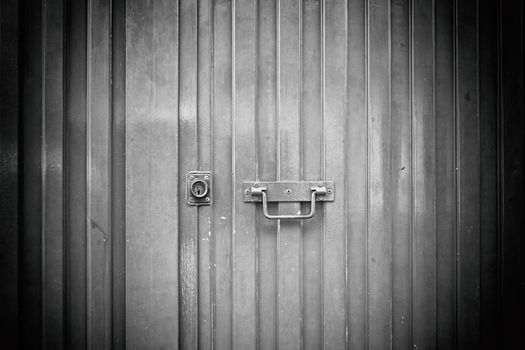 Blue metal door, detail of a closed door painted blue