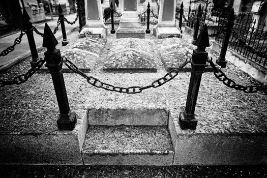 Old graves in a cemetery, detail of a Christian place, death