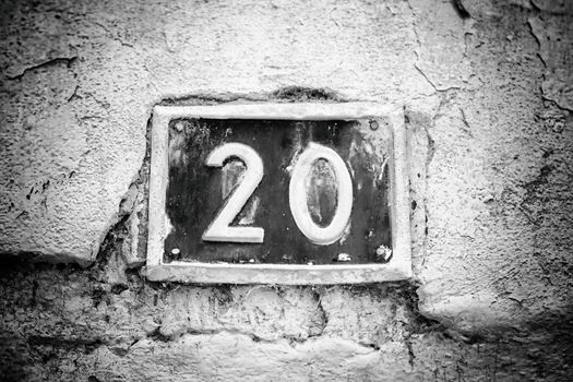 Number twenty on the wall of a house, number of information, even number