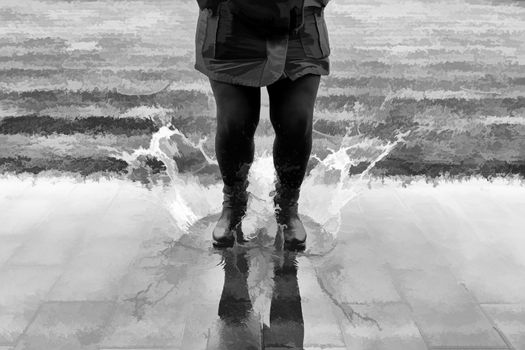 Jumping in a puddle of water, detail of a rainy day