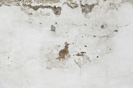 Concrete wall with moisture, detail of erosion and ruin, textured background