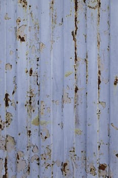 Spoiled metal wall, detail of a rusty metal, textured background