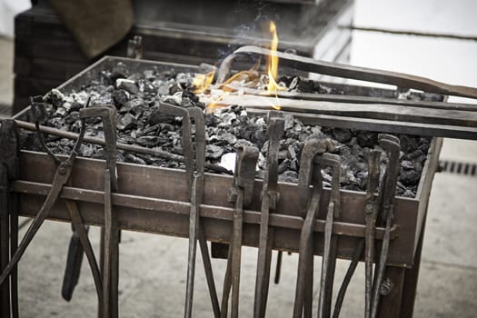 Embers in a forge, detail of an old iron forge, molding iron