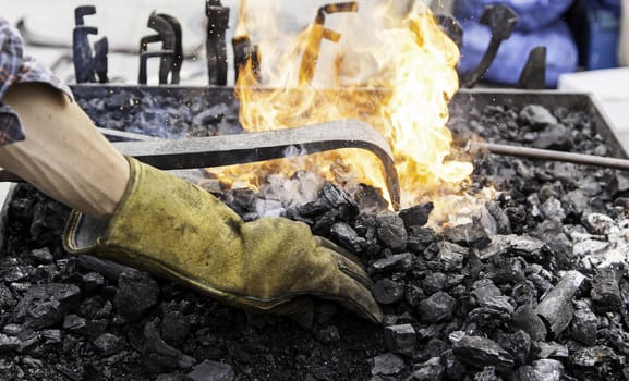 Embers in a forge, detail of an old iron forge, molding iron