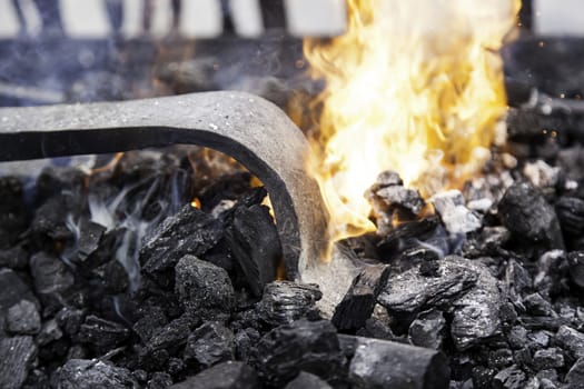 Embers in a forge, detail of an old iron forge, molding iron