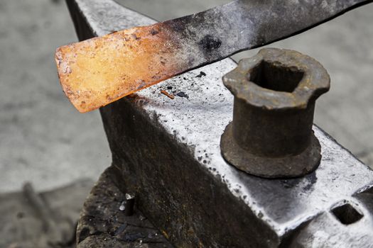 Red hot iron in a forge, working with hot iron, traditional work