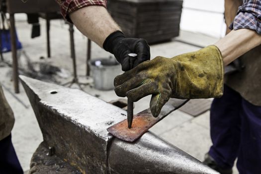 Red hot iron in a forge, working with hot iron, traditional work