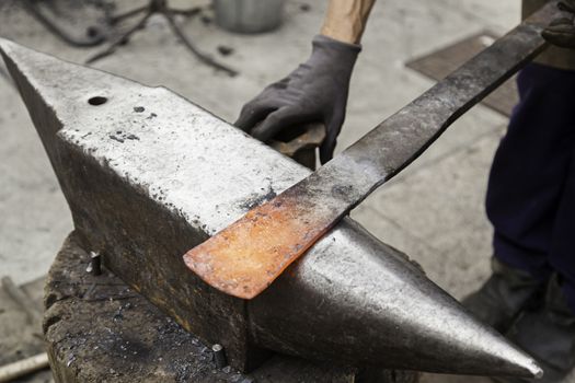 Red hot iron in a forge, working with hot iron, traditional work