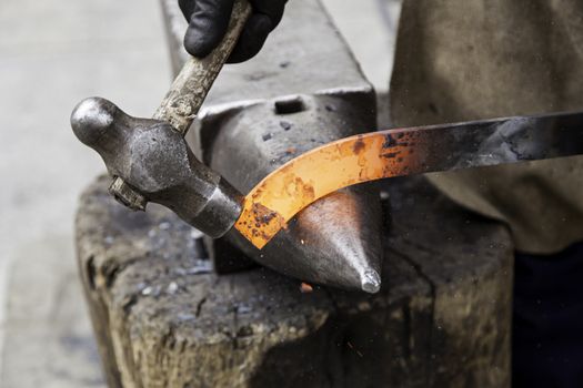 Red hot iron in a forge, working with hot iron, traditional work