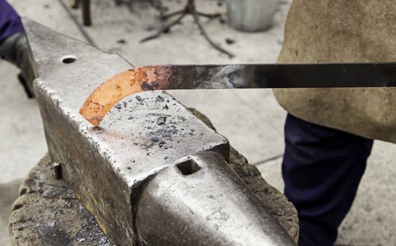 Red hot iron in a forge, working with hot iron, traditional work