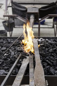 Embers in a forge, detail of an old iron forge, molding iron