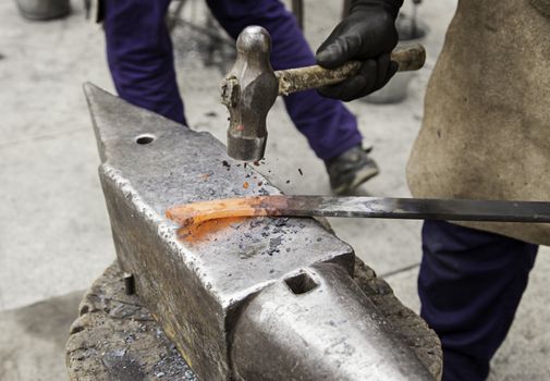 Red hot iron in a forge, working with hot iron, traditional work