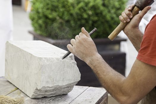 Carving stone, craftsman shaping stone, art and crafts