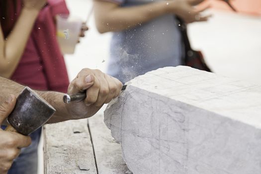 Carving stone, craftsman shaping stone, art and crafts