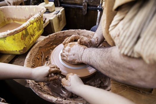 Person working with clay, detail of craftsmanship, craftsmanship in clay, potter