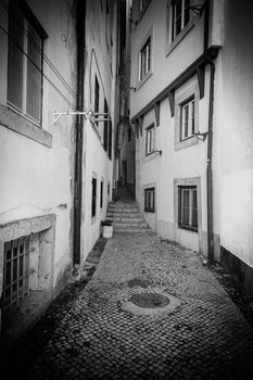 Old alley in the city, detail of an old city, promenade and tourism