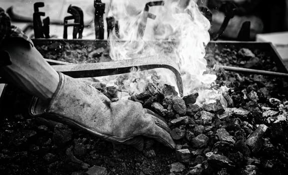 Embers in a forge, detail of an old iron forge, molding iron