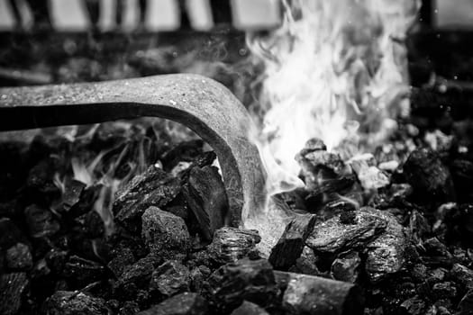 Embers in a forge, detail of an old iron forge, molding iron