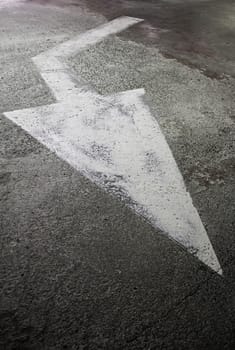 Arrow of indication on the road, detail of traffic signal, traffic