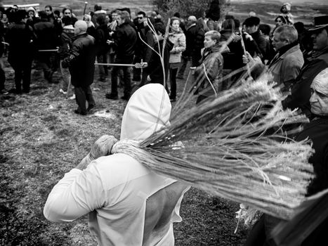 SAN VICENTE DE LA SONSIERRA, SPAIN - GOOD FRIDAY FRIDAY APRIL 6: Man does penance through self-flagellation during Easter holy procession on April 6, 2012, San Vicente de la Sonsierra, Spain.