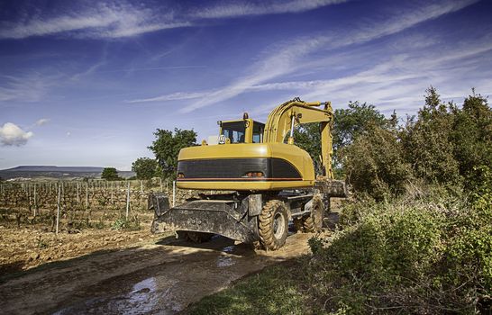 Excavator, field, detail of heavy machinery working