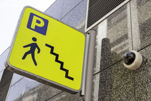 Sign of a ladder of a parking lot, detail of a signal of information for pedestrians