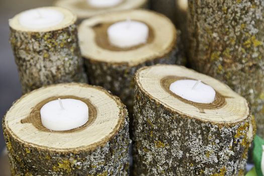 Candles with wood, detail of some candles in a spa, zen relaxation