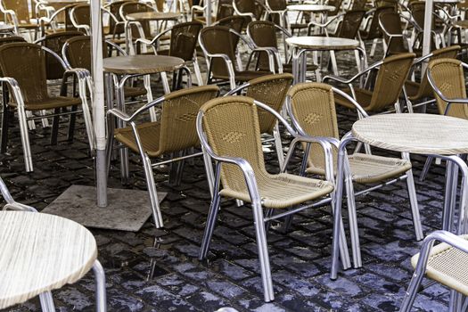 Terrace of a bar, detail of some tables and chairs, to rest and drink something