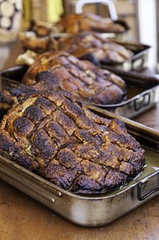 Roasted pork ham in a market