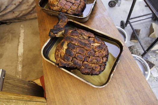 Roasted pork ham in a market