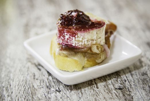 Goat cheese and raspberry, gourmet appetizer detail, haute cuisine