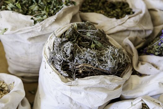 Aromatic herbs in a market, detail of herbal medicine and condiments, aroma and taste, health
