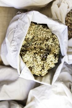 Aromatic herbs in a market, detail of herbal medicine and condiments, aroma and taste, health