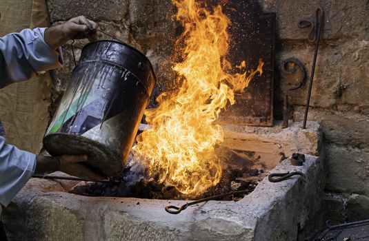 Extinguishing flames with water in the carbon, safety detail
