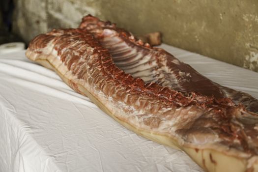Detail of half cut pork, meat in a butcher shop