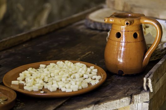 Cheese and wine in an old wine cellar, detail of lunch