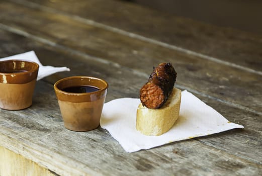 Glass of wine and chorizo, detail of lunch