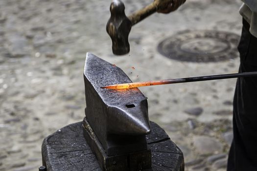 Red hot iron in a forge, working with hot iron, traditional work