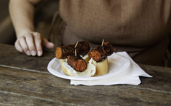 Glass of wine and chorizo, detail of lunch