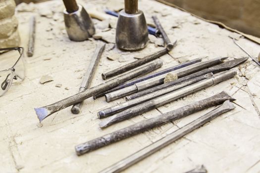 Old tools for stone carving handcrafted, detail of a manual craft