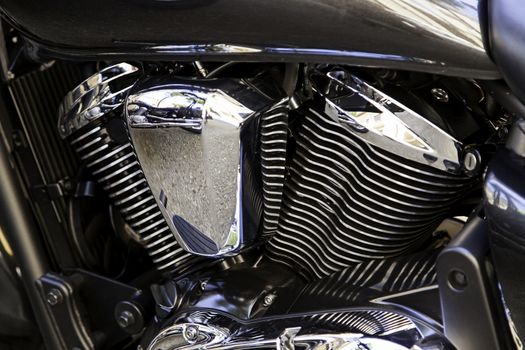 Modern new engine of big displacement motorcycle, detail of speed and power
